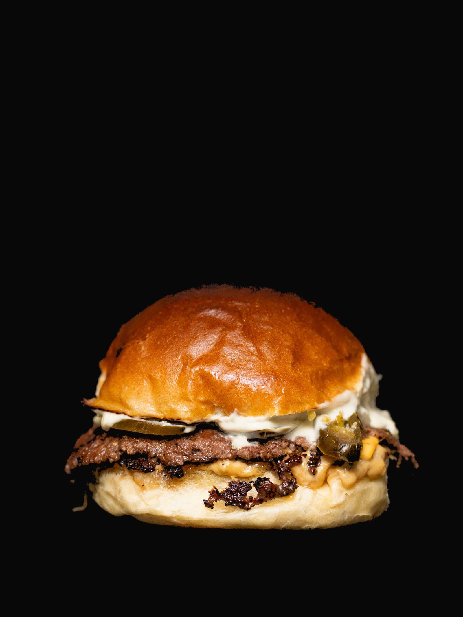 Jalapeño Smash — Smashed beef, fresh jalapeños, Monterey Jack and chipotle mayo. Heat with a backbone.